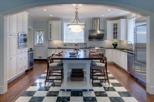 baltimore kitchen design with arched entry, marble and hardwood floors, white cabinetry and stainless steel appliances by Owings Brothers