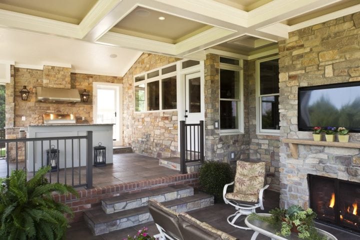 Outdoor Kitchen with stone, brick, coffered ceiling, Wolf stove and gas fireplace by Owings Brothers.