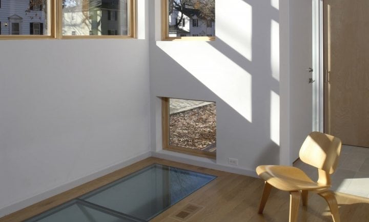 natural light streaming from glass floor tiles and windows