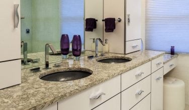 Remodeled Master Bathroom by Owings Brothers Contracting in Maryland with double vanity and towers that organize everything.