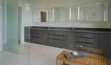 very modern double sink gray tone master bath vanity