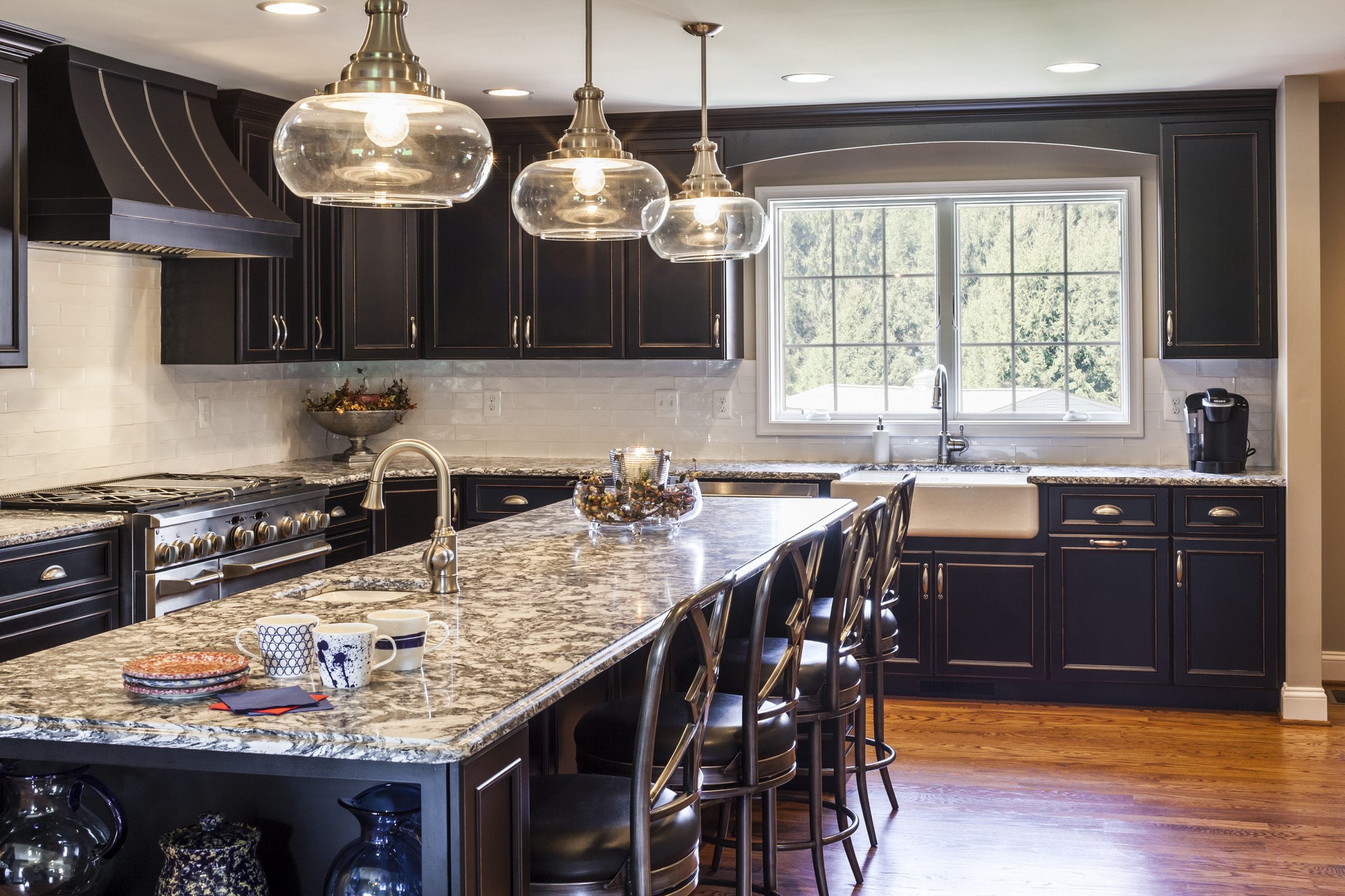 Renovated kitchen with granite countertops and 10 foot kitchen island