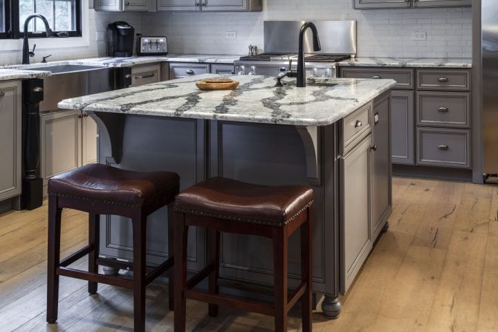 Rustic kitchen remodel with gray cabinets and Cambria countertops in Seagrove by Owings Brothers.