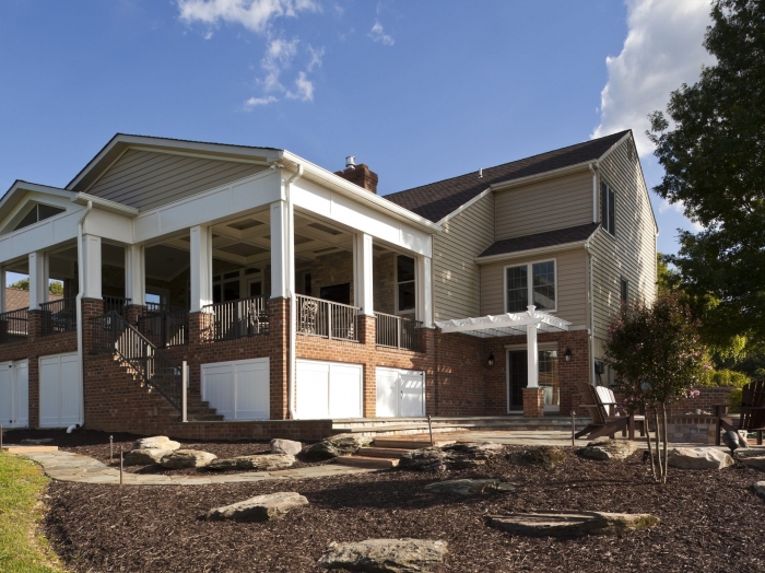 Howard County screened porch two level with outdoor kitchen and fireplace by owings brothers contracting