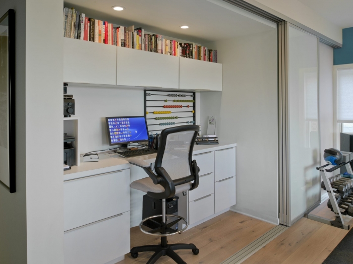 Disappearing contemporary home office by Owings Brothers Contracting