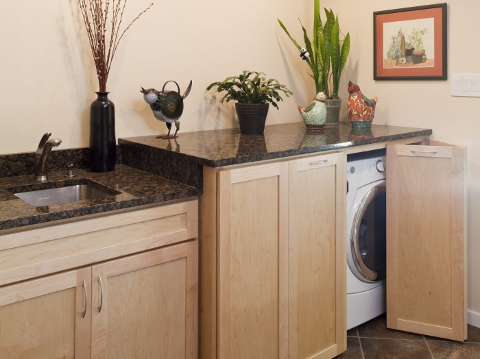Disappearing washer and dryer by Owings Brothers Contracting