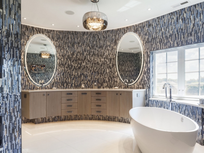 Ultra modern master bath in the round with soaking tub, curved shower and vanity