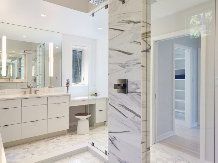 Contemporary waterfront master bathroom shower and vanity in marble