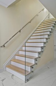staircase with glass railings
