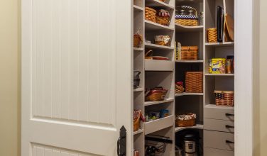 walk in pantry with custom shelving from closets and storage by Owings