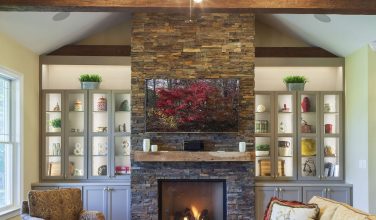 family room with stone fireplace