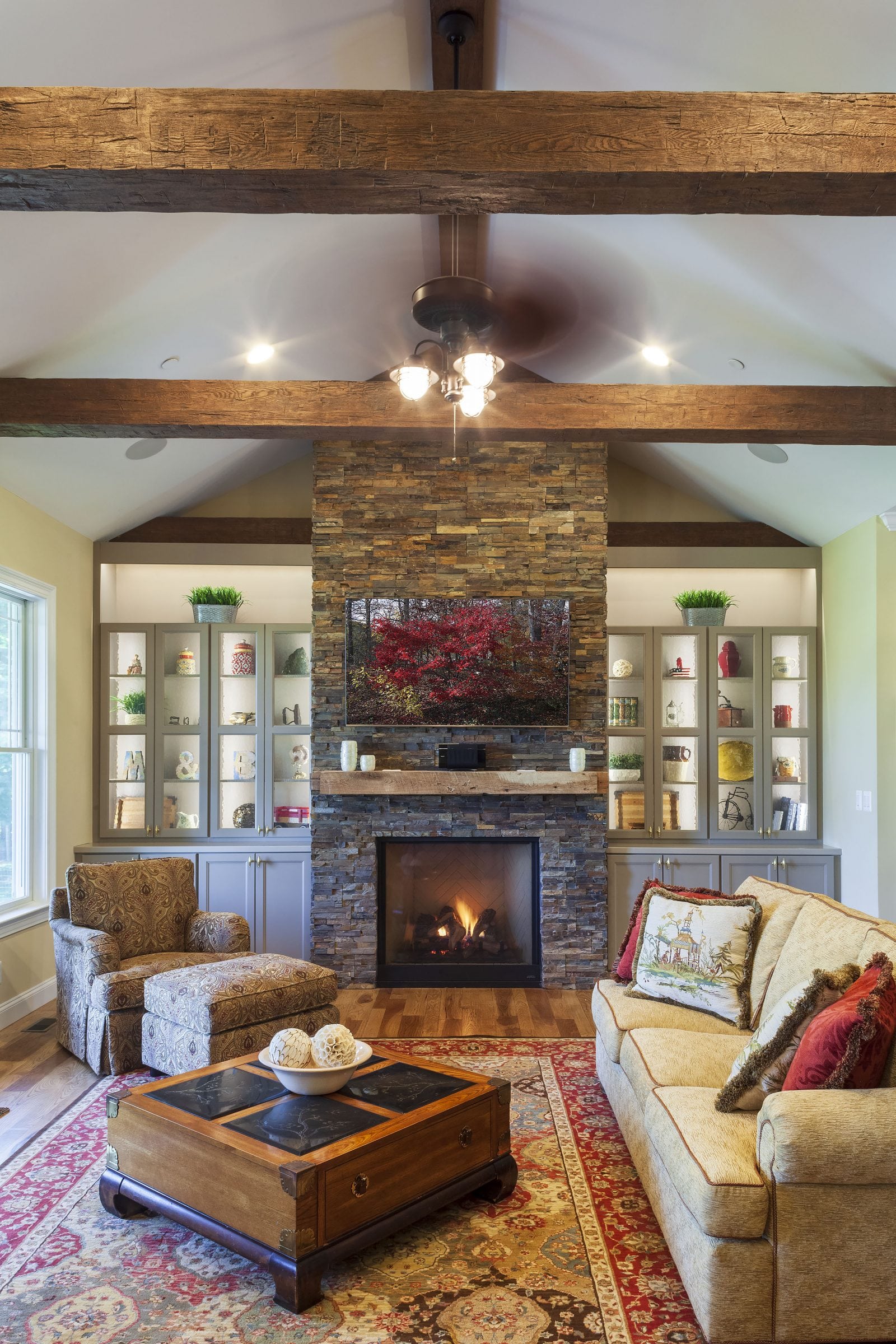 family room with stone fireplace