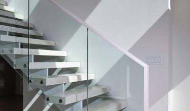 Glass-enclosed floating staircase with 3″ white oak treads