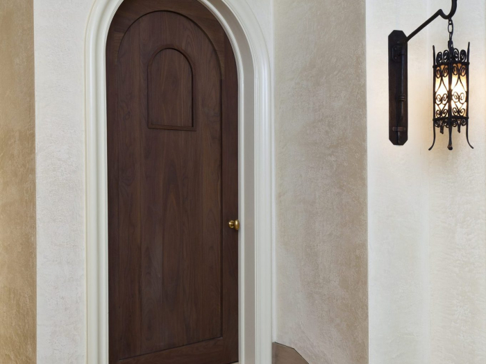 Owings Bros rounded cut stained wood interior door