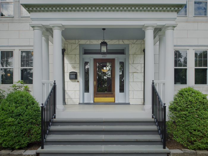 elegant old home with impressive entry door brass kick panel, transom and sidelights