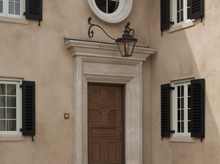 Owings Bros European type stained wood door with heavy exterior trim