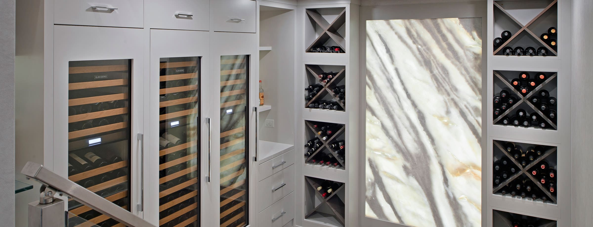 wine room with backlit marble award winner for Owings Brothers Contracting