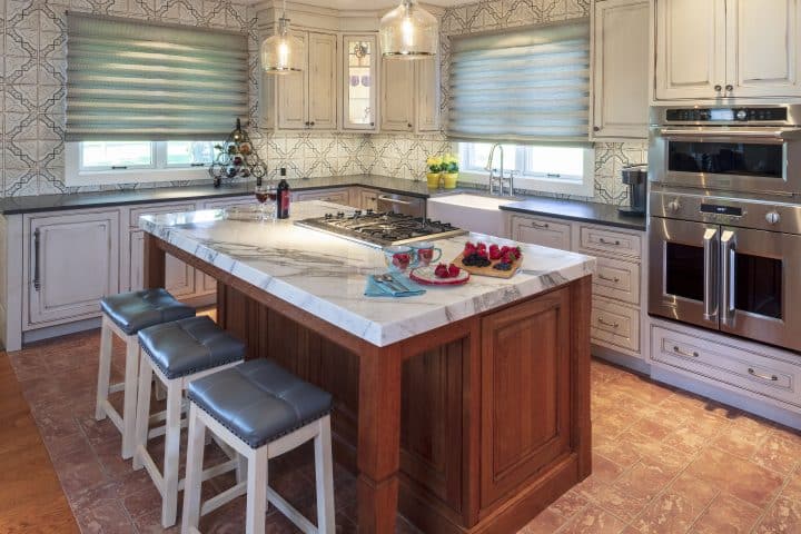 traditional kitchen design with dura supreme cabinetry and marble island top
