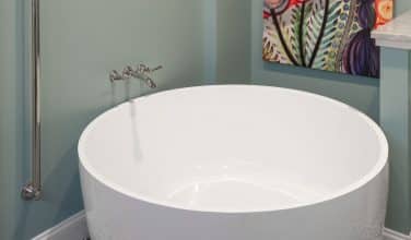 Round Asian free standing tub with wall mounted tub filler