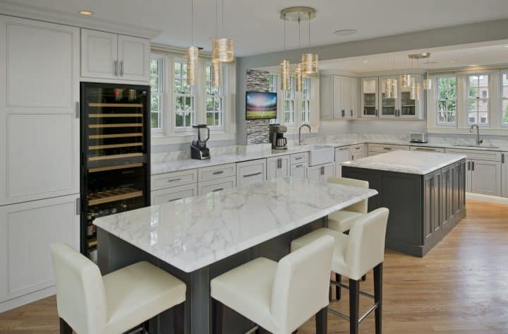 white and gray kitchen with double island