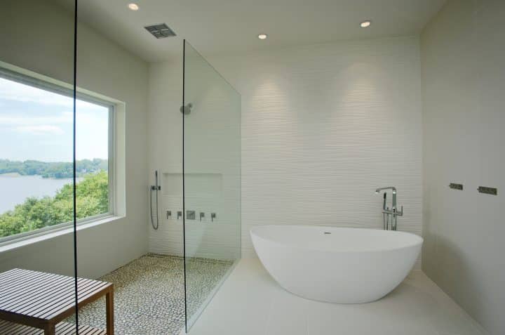 walk in curbless shower with glass panel and picture window
