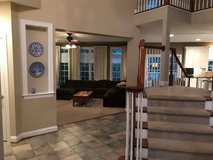 before staircase with landing in center of foyer