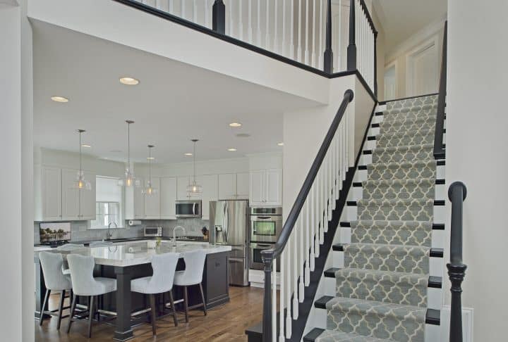 redesigned first floor to open concept with new staircase and raised family room