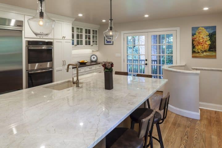 large kitchen island and white cabinetry