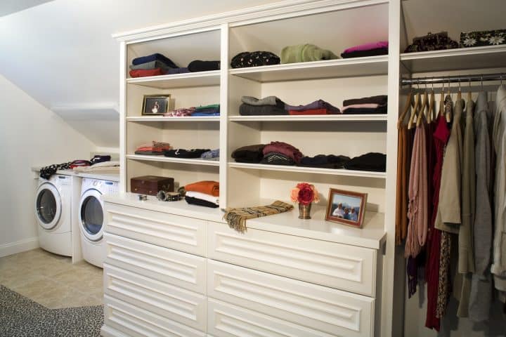 master closet with laundry area