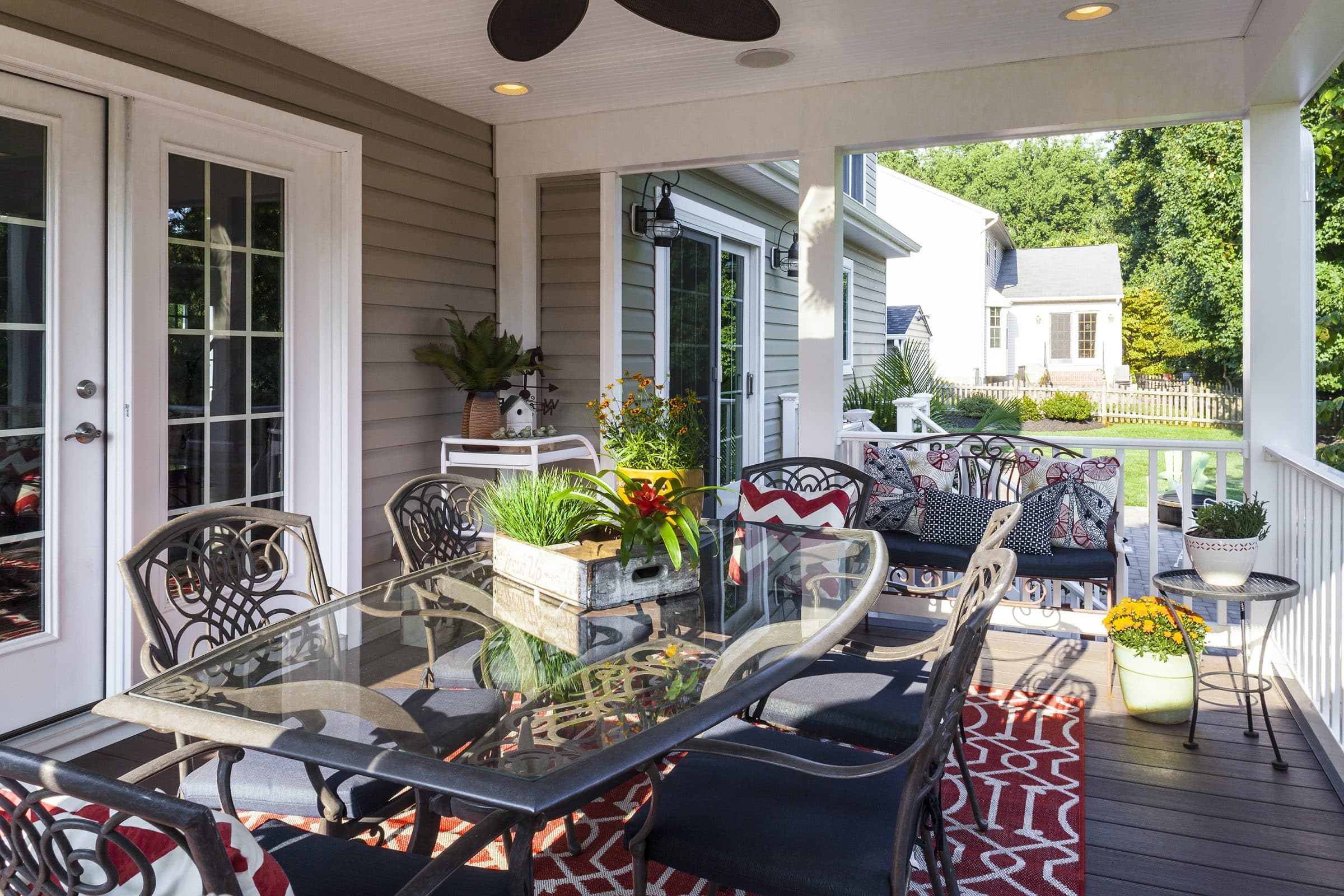 covered porch addition with lower level patio outdoor living