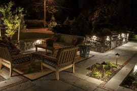 concrete paver patio with outdoor lighting