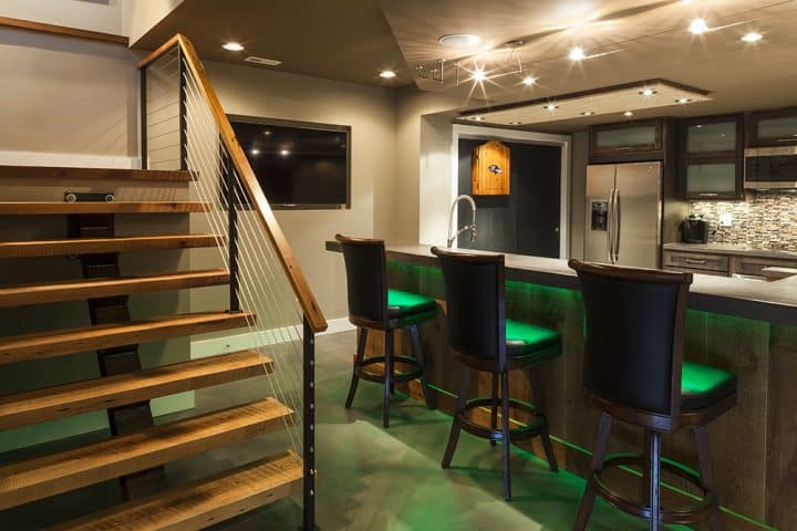 basement home bar with lighting