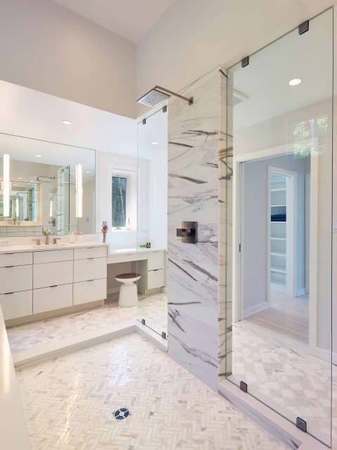 marble tile in master bath with open walk in shower