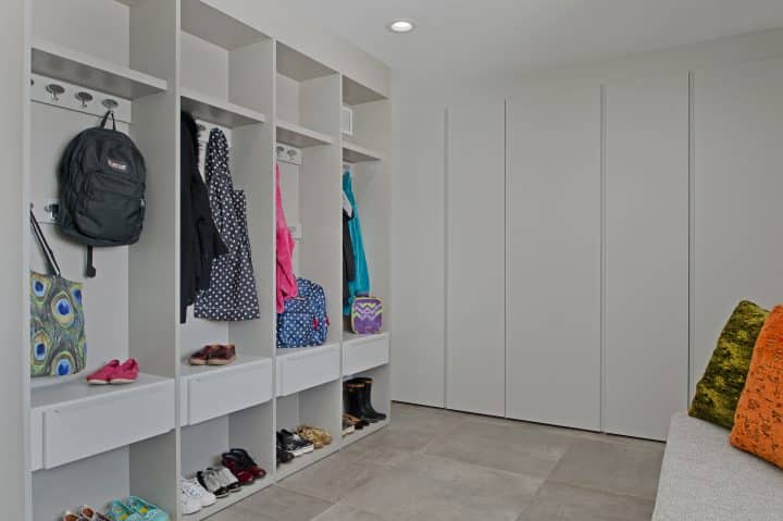 modern custom cubbies and press and close closets in mudroom