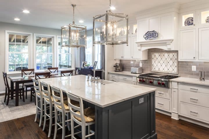 white painted kitchen cabinets with gray painted island