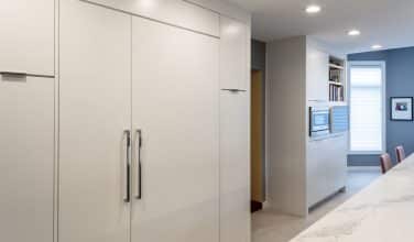 cabinet front sub zero refrigerator with long Podium polished chrome appliance puls