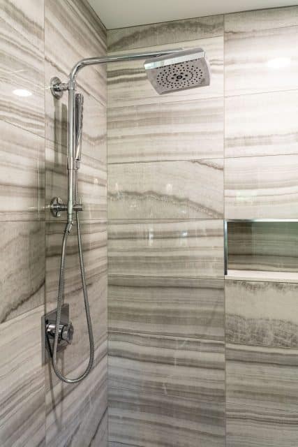 fully tiled shower with travertine-look ceramic tile