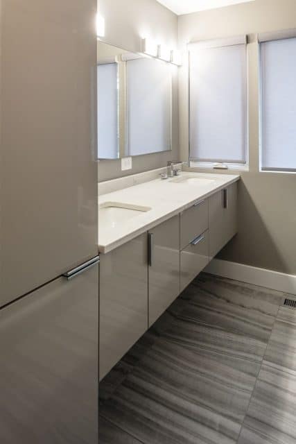 travertine-look ceramic tile bathroom floor and floating vanity