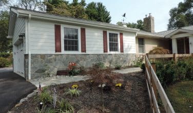 Hardi Board Siding on new Garage with red shutters