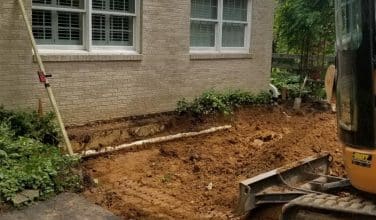 preparing ground for garage addition