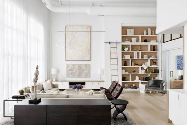 open concept living with custom floor to ceiling bookcase