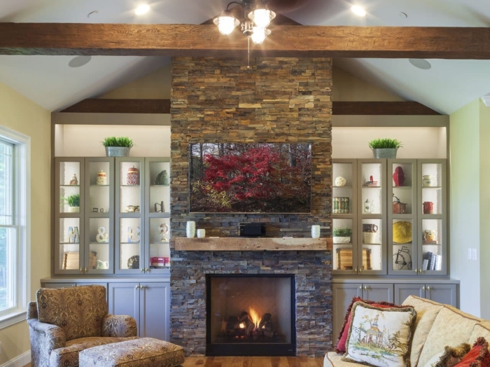 living room with stone fireplace
