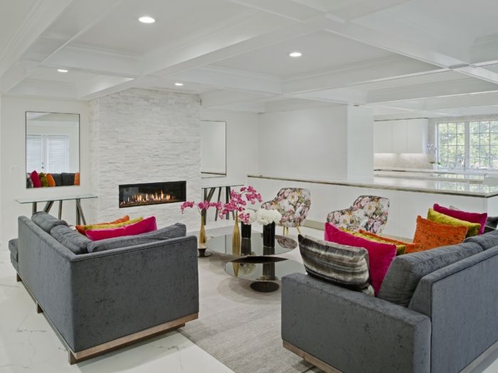 white marble floors and fireplace with coffered ceiling in modern living room