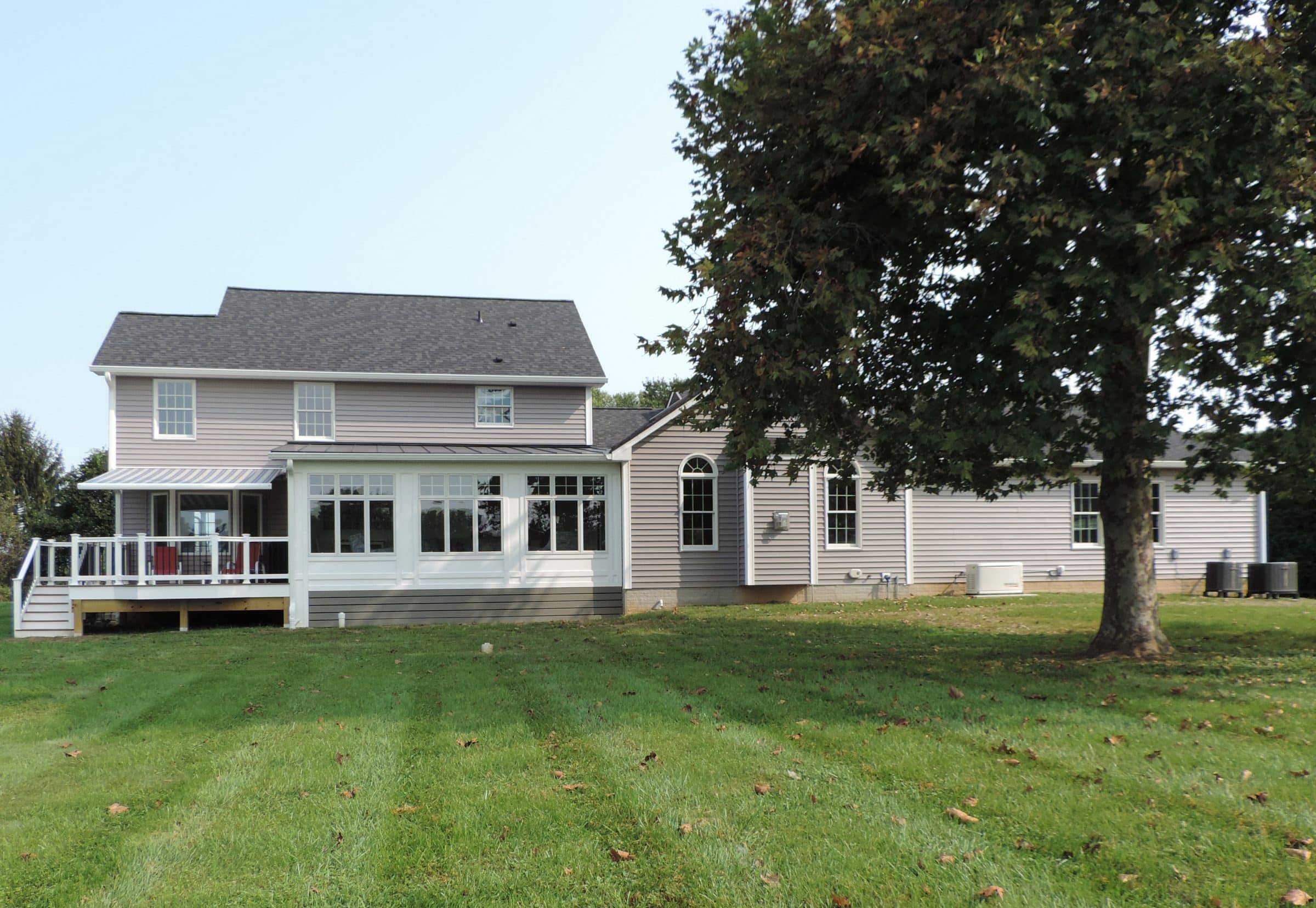 family room and sunroom addition and three car garage