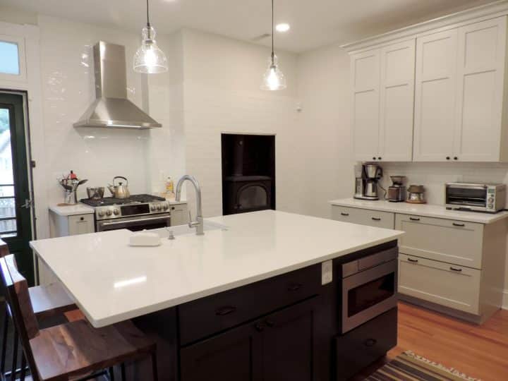 large kitchen island with reflective white countertop