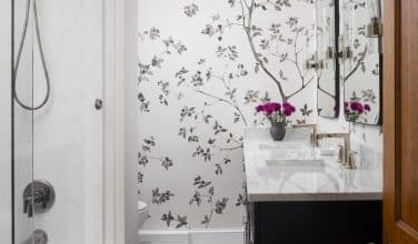 updated hall bathroom with beautiful wallpaper