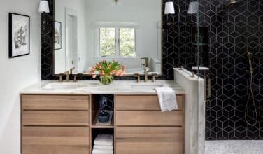 luxurious bathroom with black tile and Durasupreme double sink vanity