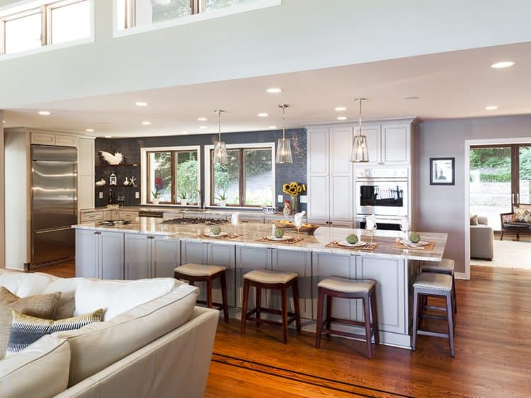 transitional kitchen in gray and white with blue glass tile backsplash