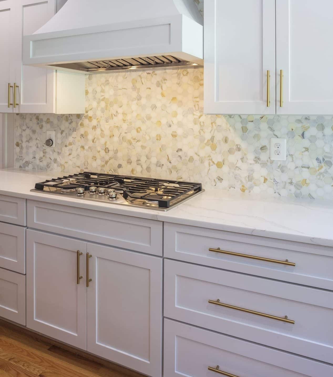 neutral multi colored tile backsplash adding interest