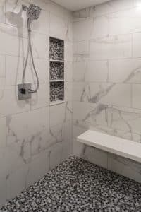 enlarged walk-in shower with white tile